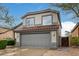 Charming two-story home featuring a tile roof, well-maintained landscaping, and a spacious two-car garage at 4514 E Coyote Wash Dr, Cave Creek, AZ 85331