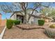 Inviting home exterior showcasing desert landscaping, mature trees, and a well-manicured front yard at 4514 E Coyote Wash Dr, Cave Creek, AZ 85331