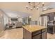 Open-concept kitchen with granite island, stainless steel appliances, and access to living room at 4514 E Coyote Wash Dr, Cave Creek, AZ 85331