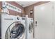 Modern laundry room featuring new appliances, custom cabinets, and shelving at 4514 E Coyote Wash Dr, Cave Creek, AZ 85331