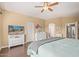 Spacious main bedroom featuring modern decor, a ceiling fan, and hardwood floors at 4514 E Coyote Wash Dr, Cave Creek, AZ 85331
