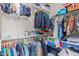 Walk-in closet featuring double rods, shelving, and ample storage space at 4514 E Coyote Wash Dr, Cave Creek, AZ 85331