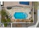 Aerial view of a swimming pool with surrounding patios and landscaped backyard at 5932 W Poinsettia Dr, Glendale, AZ 85304