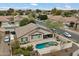 Aerial view of a property with desert landscaping, swimming pool and solar panels at 5932 W Poinsettia Dr, Glendale, AZ 85304