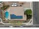 Aerial view of a home showing a swimming pool, patio, desert landscaping, and solar panels at 5932 W Poinsettia Dr, Glendale, AZ 85304