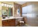 Stylish bathroom with modern fixtures, a sleek vanity, and a luxurious shower at 5932 W Poinsettia Dr, Glendale, AZ 85304
