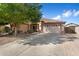 Charming single-story home featuring a well-manicured yard and a spacious two-car garage at 5932 W Poinsettia Dr, Glendale, AZ 85304