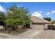 Charming single-Gathering home featuring desert landscaping, a two-car garage, and a tile roof at 5932 W Poinsettia Dr, Glendale, AZ 85304