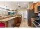 Modern kitchen featuring stainless steel appliances and ample counter space at 5932 W Poinsettia Dr, Glendale, AZ 85304