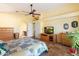 Spacious main bedroom with a ceiling fan, ample storage, and a connected bathroom at 5932 W Poinsettia Dr, Glendale, AZ 85304