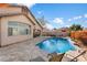 Backyard pool featuring a lounge area, barbecue, and well-maintained landscaping at 5932 W Poinsettia Dr, Glendale, AZ 85304
