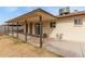 Covered patio extending from the home creates an inviting space for outdoor relaxation and entertainment at 6031 W Hearn Rd, Glendale, AZ 85306