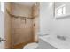 Bathroom with tiled shower, mosaic floor, and a sleek vanity with sink at 6031 W Hearn Rd, Glendale, AZ 85306