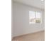 Bright bedroom featuring a window, neutral walls, and tile flooring at 6031 W Hearn Rd, Glendale, AZ 85306