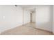 Empty bedroom with sliding mirror closet doors, and a bright doorway to the hallway at 6031 W Hearn Rd, Glendale, AZ 85306