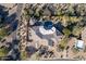 Bird's eye view of an estate featuring a private pool, landscaped backyard, and unique roof design at 6240 E Ironwood Dr, Scottsdale, AZ 85266