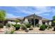 Stunning front exterior with desert landscaping, a large Saguaro cactus, and modern design elements at 6240 E Ironwood Dr, Scottsdale, AZ 85266