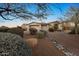 Beautiful home with a brick driveway, three-car garage, and professionally landscaped front yard at 6240 E Ironwood Dr, Scottsdale, AZ 85266