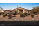 Stunning Southwestern-style home with desert landscaping, a cactus, and inviting curb appeal at 6240 E Ironwood Dr, Scottsdale, AZ 85266