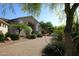 Charming front yard with desert landscaping, brick driveway, and inviting home entrance at 6240 E Ironwood Dr, Scottsdale, AZ 85266