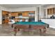 Game room with a pool table and a view of kitchen and bar area at 6240 E Ironwood Dr, Scottsdale, AZ 85266