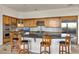 Spacious kitchen features wood cabinets, stainless steel appliances, and a center island with seating at 6240 E Ironwood Dr, Scottsdale, AZ 85266