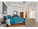 View of the primary bedroom with carpet and a beautiful wooden dresser and vanity at 6240 E Ironwood Dr, Scottsdale, AZ 85266