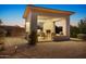 Outdoor kitchen with sink, grill, fireplace, and lounge chairs create an inviting space for entertaining at 6240 E Ironwood Dr, Scottsdale, AZ 85266