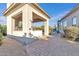 Outdoor kitchen with a stainless steel grill, sink, brick pavers and an outdoor shower at 6240 E Ironwood Dr, Scottsdale, AZ 85266