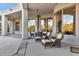 Expansive covered patio with ample seating, ideal for outdoor dining and entertaining at 6240 E Ironwood Dr, Scottsdale, AZ 85266