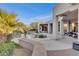 Beautiful backyard pool and patio area surrounded by lush landscaping at 6240 E Ironwood Dr, Scottsdale, AZ 85266