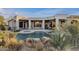 Backyard pool and patio area framed by desert landscaping, creating a tranquil outdoor oasis at 6240 E Ironwood Dr, Scottsdale, AZ 85266