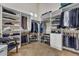 Spacious walk-in closet with custom shelving, hanging rods, and ample storage at 6240 E Ironwood Dr, Scottsdale, AZ 85266