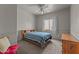 Bedroom with a ceiling fan, window, and standard closet; furnished with a double bed and wooden furniture at 640 E Desert Canyon Rd, Wickenburg, AZ 85390