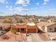 Desert home showcasing stucco exterior, tile roof, low-maintenance landscaping, and a paved driveway at 640 E Desert Canyon Rd, Wickenburg, AZ 85390