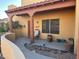 Inviting front porch featuring desert landscaping, comfortable seating, and a well-maintained walkway at 640 E Desert Canyon Rd, Wickenburg, AZ 85390