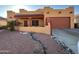 Charming single story home with beautiful xeriscape landscaping and covered entryway at 640 E Desert Canyon Rd, Wickenburg, AZ 85390