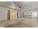 Spacious garage with built-in shelving, water heater, storage cabinets, and ample room for parking at 640 E Desert Canyon Rd, Wickenburg, AZ 85390
