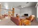 Open-concept living room with unique wood furniture, neutral color scheme, and seamless flow to the kitchen at 640 E Desert Canyon Rd, Wickenburg, AZ 85390