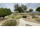 The backyard has desert landscaping with a fountain and a gazebo at 6628 W Kristal Way, Glendale, AZ 85308