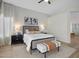 Beautiful main bedroom featuring neutral walls, a ceiling fan, and a king size bed with decorative pillows at 6822 S Rachael Way, Gilbert, AZ 85298