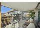 Balcony features cozy seating, a modern table set, and serene views of the surrounding architecture at 7161 E Rancho Vista Dr # 6002, Scottsdale, AZ 85251
