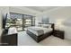 Serene bedroom with a large window, modern decor, and comfortable furnishings at 7161 E Rancho Vista Dr # 6002, Scottsdale, AZ 85251