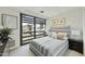 Bright bedroom features large window and minimal decor at 7161 E Rancho Vista Dr # 6002, Scottsdale, AZ 85251