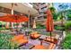 Outdoor common area with comfortable lounge seating, water feature, and shade umbrellas at 7161 E Rancho Vista Dr # 6002, Scottsdale, AZ 85251