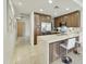 Open kitchen with stainless appliances, a center island, and counter seating at 7161 E Rancho Vista Dr # 6002, Scottsdale, AZ 85251