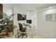 The bright office space features tiled floors and glass desk with adjacent kitchen area at 7161 E Rancho Vista Dr # 6002, Scottsdale, AZ 85251
