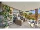 Outdoor patio area with seating and lush greenery, providing a relaxing outdoor space at 7161 E Rancho Vista Dr # 6002, Scottsdale, AZ 85251
