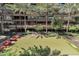 Turf putting green surrounded by palm trees with a condo building in the background at 7161 E Rancho Vista Dr # 6002, Scottsdale, AZ 85251