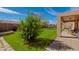 Lush green backyard with mature trees and landscaping, perfect for outdoor enjoyment at 8637 E Olla Ave, Mesa, AZ 85212